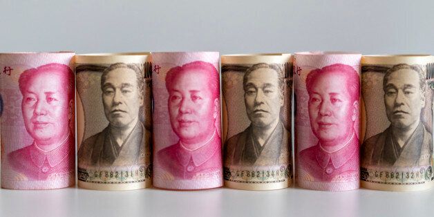 BEIJING, CHINA - 2017/03/15: Banknotes of RMB and Yen, arranged for photography. Rises in the yuan/yen exchange rate partially offset the devaluation of RMB versus US dollar, which helps provide stability for the yuan basket. In RMB basket announced on December 29,2016, China reduced the dollars weight in the index to 22.4 percent and took Japanese yen's to 11.5. (Photo by Zhang Peng/LightRocket via Getty Images)