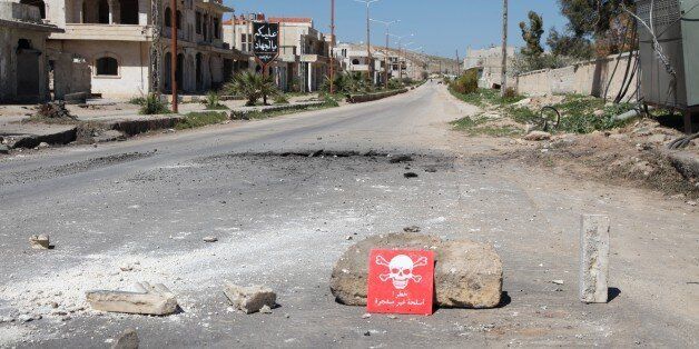 IDLIB, SYRIA - APRIL 05: A poison hazard danger sign is seen in the town of Khan Shaykun, Idlib province, Syria on April 05, 2017. On Tuesday more than 100 civilians had been killed and 500 others, mostly children, injured in Assad Regime's suspected chlorine gas attack carried out by warplanes in the town of Khan Shaykun, Idlib province. (Photo by Abdussamed Dagul/Anadolu Agency/Getty Images)