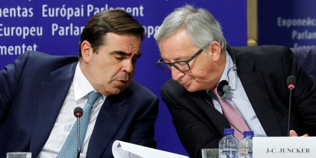 European Commission President Jean-Claude Juncker (R) talks with European Commission Chief spokesperson Margaritis Schinas during a news conference after the presentation a White Paper on the Future of Europe in Brussels, Belgium, March 1, 2017. REUTERS/Yves Herman