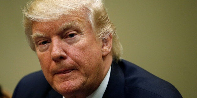 U.S. President Donald Trump looks up while attending a Women in Healthcare meeting at the White House in Washington, U.S., March 22, 2017. REUTERS/Kevin Lamarque