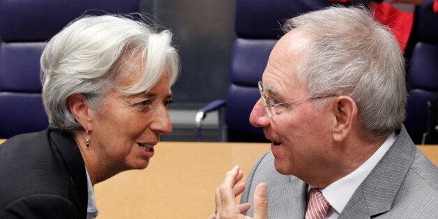 France's Finance Minister Christine Lagarde talks to her German counterpart Wolfgang Schaeuble (R) during a euro zone finance ministers meeting in Luxembourg June 20, 2011. REUTERS/Francois Lenoir (LUXEMBOURG - Tags: BUSINESS POLITICS)