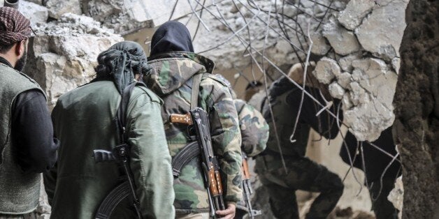 DAMASCUS, SYRIA - MARCH 22: Opposition forces members break through as clashes between opposition forces and Assad regime forces continue in Jobar district of Damascus, Syria on March 22, 2017. (Photo by Ammar Suleyman/Anadolu Agency/Getty Images)