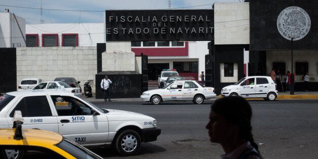 A pedestrian passes in front of the Nayarit State Attorney Generals headquarters in Tepic, Mexico, on Wednesday, March 29, 2017. On Wednesday, Nayarit Attorney General Edgar Veytia was arrested at the U.S. And Mexico border on drug trafficking charges filed by New York state on March 2. Photographer: Cesar Rodriguez/Bloomberg via Getty Images