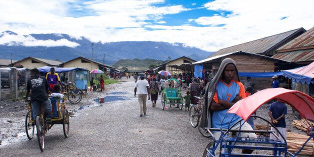 Wamena, Papua Province, Indonesia - April 24, 2009: Rickshaw drivers are seen as part of the urban scene of the town of Wamena and the surrounding landscapes of the Baliem Valley, Indonesia