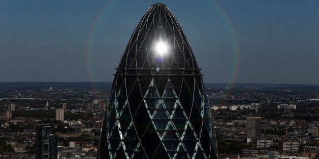 The sun reflects off the top of 30 St Mary Axe, also known as The Gherkin, in London, U.K., on Tuesday, Aug. 23, 2016. Commercial property prices are falling across London, as banks, corporations and ordinary people try to assess the business and economic fallout. Photographer: Chris Ratcliffe/Bloomberg via Getty Images