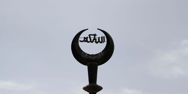 A picture taken on May 18, 2016 shows the crescent with the Arabic phrase Allahu Akbar (Allah is the greatest) on top of a mosque in Jerusalem's Old City. / AFP / THOMAS COEX (Photo credit should read THOMAS COEX/AFP/Getty Images)