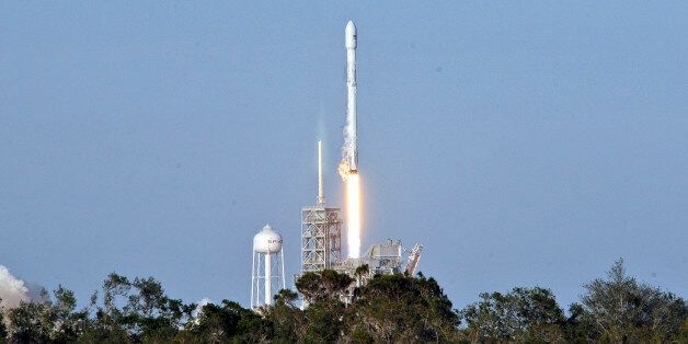 SpaceX's Falcon 9 rocket lifts off from space launch complex 39A at Kennedy Space Center, Florida on March 30, 2017, with an SES communications satellite. SpaceX blasted off a recycled rocket for the first time on, using a booster that had previously flown cargo to the astronauts living at the International Space Station. / AFP PHOTO / BRUCE WEAVER (Photo credit should read BRUCE WEAVER/AFP/Getty Images)