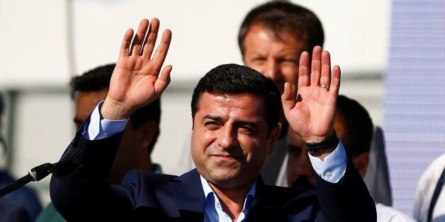 Selahattin Demirtas, co-leader of the pro-Kurdish Peoples' Democratic Party (HDP), greets the crowd during a peace rally to protest against Turkish military operations in northern Syria, in Istanbul, Turkey, September 4, 2016. REUTERS/Osman Orsal
