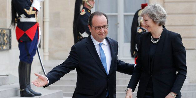 French President Francois Hollande (L) greets Britain's Prime Minister Theresa May at the Elysee Palace in Paris, France, July 21, 2016. REUTERS/Philippe Wojazer