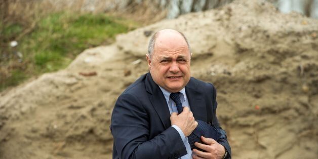 French interior minister Bruno Le Roux visits the former migrant camp of 'La Lande' in Calais on March 1, 2017, during the presentation of the site's remediation project by the shoreline's protection office. / AFP PHOTO / PHILIPPE HUGUEN (Photo credit should read PHILIPPE HUGUEN/AFP/Getty Images)
