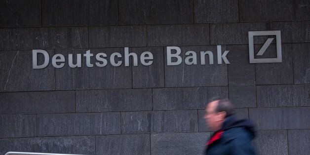 A pedestrian passes a Deutsche Bank AG office in Frankfurt, Germany, on Thursday, Feb. 2, 2017. Frankfurt expects as many 10,000 workers from Britain's financial services industry to relocate to Germany's banking capital because of Brexit, with the exodus likely to start within weeks, according to lobby group Frankfurt Main Finance. Photographer: Krisztian Bocsi/Bloomberg via Getty Images