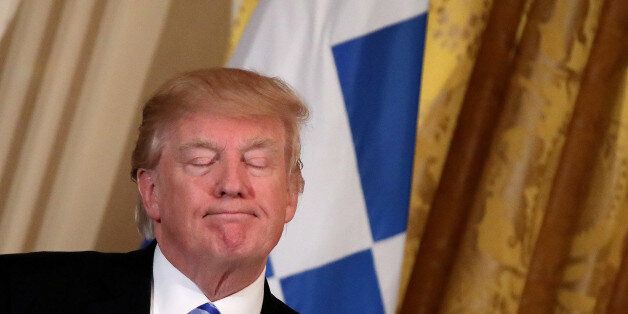 U.S. President Donald Trump reacts as he hosts a Greek Independence Day celebration at the East room of the White House in Washington, U.S. March 24, 2017. REUTERS/Carlos Barria