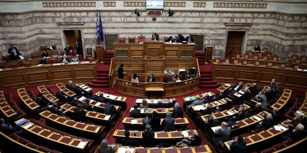 Greek lawmakers attend a parliamentary session before a vote on a one-off benefit approved to pensioners in Athens, Greece, December 15, 2016. REUTERS/Alkis Konstantinidis