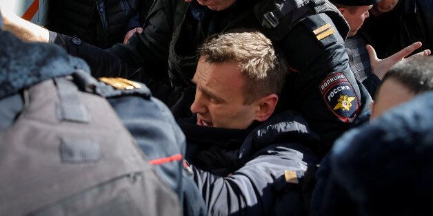 Police officers detain anti-corruption campaigner and opposition figure Alexei Navalny during a rally in Moscow, Russia, March 26, 2017. REUTERS/Maxim Shemetov