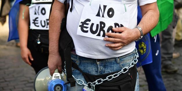 People take part in a demonstration against the European Union (Euro Stop) on March 25, 2017 in Rome. Italian capital hosts a special summit of European leaders today to mark the 60th anniversary of the bloc's founding treaties. / AFP PHOTO / Alberto PIZZOLI (Photo credit should read ALBERTO PIZZOLI/AFP/Getty Images)