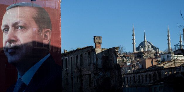 ISTANBUL, TURKEY - MARCH 29: A 'EVET' (Yes) campaign billboard showing the portrait of Turkish President Recep Tayyip Erdogan is seen on March 29, 2017 in Istanbul, Turkey. Campaigning by both the 'Evet'(Yes) and 'Hayir' (No) camps has intensified this week ahead of Turkey holding a constitutional referendum on April 16, 2017. Turks will vote on 18 proposed amendments to the Constitution of Turkey. The controversial changes seek to replace the parliamentary system and move to a presidential system which would give President Recep Tayyip Erdogan executive authority. (Photo by Chris McGrath/Getty Images)