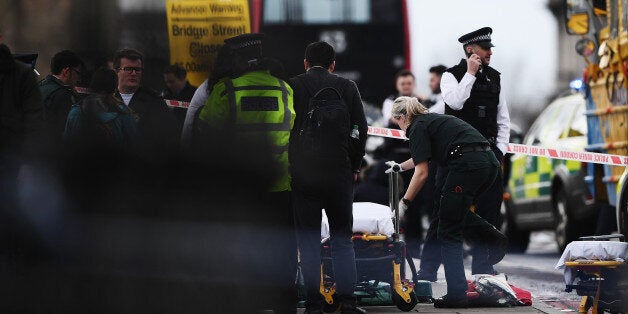 LONDON, ENGLAND - MARCH 22: Medical staff in attendance near Westminster Bridge on March 22, 2017 in London, England. A police officer has been stabbed near to the British Parliament and the alleged assailant shot by armed police. Scotland Yard report they have been called to an incident on Westminster Bridge where several people have been injured by a car. (Photo by Carl Court/Getty Images)