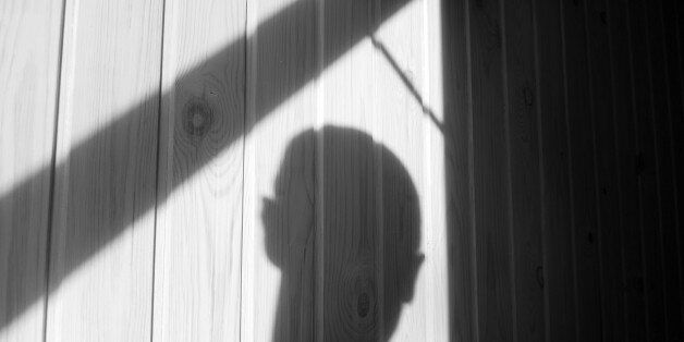 Shadow of burglar (or murderer or rapist) just before he makes his entrance through an open window.