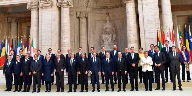 (Front row, LtoR) Taoiseach of Ireland Enda Kenny, Hungary's prime Minister Viktor Orban, President of Bulgaria Rumen Radev, President of Cyprus Nicos Anastasiades, Lithuania's President Dalia Grybauskaite, President of the European Commission Jean-Claude Juncker, European Parliament President Antonio Tajani, Italy's Prime Minister Paolo Gentiloni, President of the European Council Donald Tusk, Malta's Prime minister Joseph Muscat, France's President Francois Hollande, President of Romania Klaus Werner Iohannis, Germany's Chancellor Angela Merkel, Netherland's Prime Minister Mark Rutte, Spain's Prime Minister Mariano Rajoy, and (second row, LtoR) Estonia's prime Minister Juri Ratas, Federal Chancellor of Austria Christian Kern, Portugal's Prime Minister Antonio Costa, Greec's Prime Minister Alexis Tsipras, Finland's Prime Minister Juha Sipila, Sweden's Prime Minister Stefan Lofven, Czech Republic's Prime Minister Bohuslav Sobotka, Slovakia's Prime Minister Robert Fico, Luxembourg's Prime Minister Xavier Bettel, Slovenia's Prime Minister Miro Cerar, Belgium's Prime Minister Charles Michel, Denmark's Prime Minister Lars Lokke Rasmussen, Poland's Prime Minister Beata Szydlo, Latvia's Prime Minister Maris Kucinskis, Croatia's prime Minister Andrej Plenkovic and Rome's Mayor Virginia Raggi pose for a family photo during a special summit of EU leaders to mark the 60th anniversary of the bloc's founding Treaty of Rome, on March 25, 2017 at Rome's Piazza del Campidoglio (Capitoline Hill).Against a backdrop of crises and in the absence of the departing Britain, the leaders signed a new Rome declaration, six decades after the six founding members signed the Treaty of Rome and gave birth to the European Economic Community. / AFP PHOTO / Andreas SOLARO (Photo credit should read ANDREAS SOLARO/AFP/Getty Images)