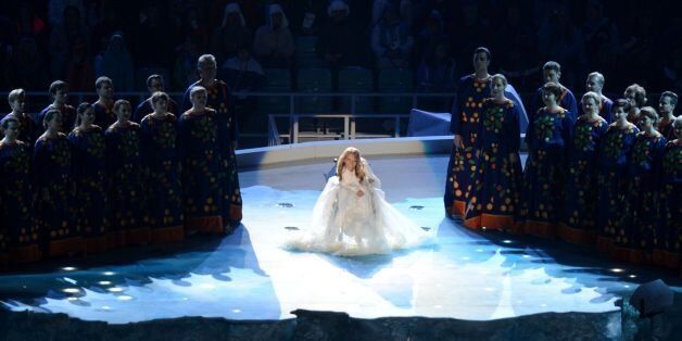 A picture taken on March 7, 2014 shows singer Yuliya Samoilova performing in the Fisht Olympic Stadium during the opening ceremony of the 2014 Winter Paralympic Games in the Black Sea resort of Sochi.Tensions between Russia and Ukraine spread to the Eurovision Song Contest on March 22 after Kiev banned a Russian contestant from entering the country over a past performance in Moscow-annexed Crimea. Ukrainian security service (SBU) spokeswoman Olena Gitlyanska told AFP that Yuliya Samoilova had been banned 'from entry for three years' for having been 'in violation of Ukrainian legislation.' Samoilova, 27, performed at the 2014 Paralympic Winter Games in Sochi, as well as at a gala concert in Crimea aimed at popularising sport in June 2015. / AFP PHOTO / KIRILL KUDRYAVTSEV (Photo credit should read KIRILL KUDRYAVTSEV/AFP/Getty Images)