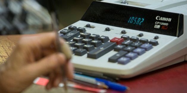 TORONTO, ON - DECEMBER 14: Just a calculator is used for figuring out the totals. Vortex Record Store founder and owner, Bert Myers, is closing his business after nearly four decades in business. (Rick Madonik/Toronto Star via Getty Images)
