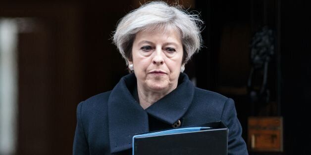 British Prime Minister Theresa May leaves 10 Downing Street in central London on March 23, 2017. Britain's parliament reopened on Thursday with a minute's silence in a gesture of defiance a day after an attacker sowed terror in the heart of Westminster, killing three people before being shot dead. Sombre-looking lawmakers in a packed House of Commons chamber bowed their heads and police officers also marked the silence standing outside the headquarters of London's Metropolitan Police nearby. / AFP PHOTO / POOL / Jack Taylor (Photo credit should read JACK TAYLOR/AFP/Getty Images)