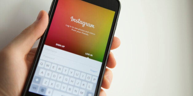 Moscow, Russia - March 21, 2015: Men hand holds iPhone 6 Plus with Instagram app. iPhone 6 Plus is product Apple Inc. Instagram is an online photo-sharing and social networking service.