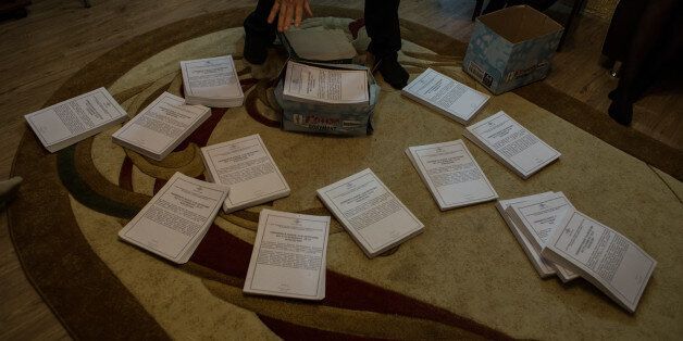 TAGANROG, ROSTOV-ON-DON REGION, RUSSIA - 11 November, 2015: Andrey Goncharov (42) shows the indictments case files in his house. Andrey faces a heavy fine. 16 Jehovah's Witnesses are accused of extremist activity in Taganrog, Russia. (Photo by Alexander Aksakov/For The Washington Post via Getty Images).
