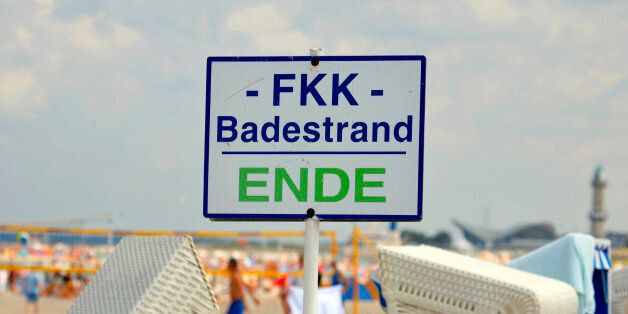 GERMANY - AUGUST 19: A reads 'End of nude Beach' at the Warnemuende beach in Rostock, Germany, Saturday, August 19, 2006.As many as 12 million Germans, who go to nude beaches at least once a year, according to Wolfgang Weinreich, the head of the International Naturist Federation, may think the same as it is becoming increasingly difficult to find a nude, or so-called FKK, beach. More than a third of them in the former East have disappeared since German reunification in 1990, said Horst Barthel, deputy head of the DFK German Naturism Federation in East Germany. (Photo by Jochen Eckel/Bloomberg via Getty Images)