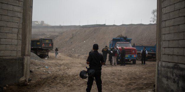 LIMA, PERU - APRIL 13. Operational police in Villa el Salvador carries out an operation against illegal mining in Lima, Peru on April 13, 2016. 200 policemen, 8 prosecutors were confiscated 4 four trucks and a forklift and the mine was closed. (Photo by Sebastian Castaneda/Anadolu Agency/Getty Images)