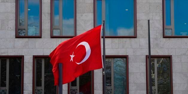 The Turkish flag flies in front of the Turkish embassy in Berlin on March 15, 2017.Turkey has been waging a war of words with its NATO partner Germany, with President Recep Tayyip Erdogan accusing it of 'Nazi practices' after several German towns blocked rallies by Turkish ministers campaigning in favour of the referendum to expand the president's powers. / AFP PHOTO / John MACDOUGALL (Photo credit should read JOHN MACDOUGALL/AFP/Getty Images)