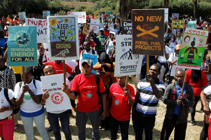 Environmental activists march carrying signs take part in the Climate strike protest calling for action on climate change, in Nairobi, Kenya.