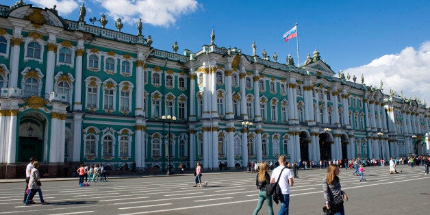 SAINT PETERSBURG, RUSSIA - JUNE 13: Pedestrians walk in front of the Hermitage museum on June 13, in Saint Petersburg, Russia. The State Hermitage, founded in 1764 by Tsar Catherine the Great, is one of the largest and oldest museums in the world. Saint Petersburg, the second largest city in Russia with 5 million inhabitants, was founded by Tsar Peter the Great on 1703. In 1914 the name of the city was changed to Petrograd, in 1924 to Leningrad, and in 1991, back to Saint Petersburg. (Photo by Lucas Schifres/Getty Images)