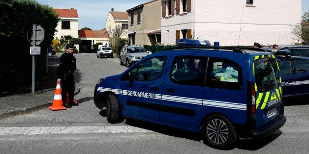 French gendarmes with their cars block the entrance to a street in Beaumont-les-Valence, southeastern France, on March 22, 2017, where the bodies of a woman and three children were discovered at their home in the morning, after the suicide of the father, who allegedly accused himself of the murder.On Wednesday morning the family's father had committed suicide by throwing himself under a train at Tain-L'Hermitage, after having left a letter in his vehicle in which he had accused himself of the murder, according to the gendarmerie. / AFP PHOTO / JEAN-PHILIPPE KSIAZEK (Photo credit should read JEAN-PHILIPPE KSIAZEK/AFP/Getty Images)