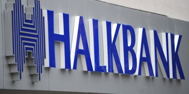 A view of a logo at the entrance of a Halkbank branch on Februrary 14, 2014, in Istanbul. Six suspects in the massive graft probe that has engulfed the Turkish government, including the former general manager of state-run Halkbank, SÃ¼leyman Aslan, were released by an Istanbul court pending trial, on February 14, 2014. AFP PHTO / OZAN KOSE (Photo credit should read OZAN KOSE/AFP/Getty Images)