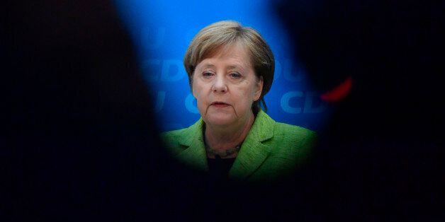 TOPSHOT - German Chancellor Angela Merkel gives a press conference one day after CDU's victory in state elections in the southwestern federal state of Saarland during a meeting with the CDU's leadership on March 27, 2017 at the party's headquarters in Berlin, In the Saarland state vote held six months before a general election, German Chancellor Angela Merkel's Christian Democrats (CDU) won 40,7 percent against 29,6 percent for the Social Democrats (SPD), according to preliminary official results. / AFP PHOTO / John MACDOUGALL (Photo credit should read JOHN MACDOUGALL/AFP/Getty Images)
