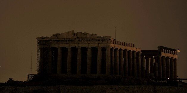 The ancient Parthenon Temple on top of the Acropolis hill is not floodlit as Greece participate in Earth Hour in Athens on March 27, 2010. More than 120 countries participate in turning off lights for 60 minutes from 8:30 to 9:30 in the evening local time in an effort to raise global awareness on climate change. AFP PHOTO / Aris Messinis (Photo credit should read ARIS MESSINIS/AFP/Getty Images)
