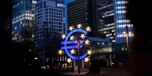 The euro sign sculpture stands illuminated near the former European Central Bank (ECB) headquarters at dusk in Frankfurt, Germany, on Thursday, Feb. 2, 2017. Frankfurt expects as many 10,000 workers from Britain's financial services industry to relocate to Germany's banking capital because of Brexit, with the exodus likely to start within weeks, according to lobby group Frankfurt Main Finance. Photographer: Krisztian Bocsi/Bloomberg via Getty Images