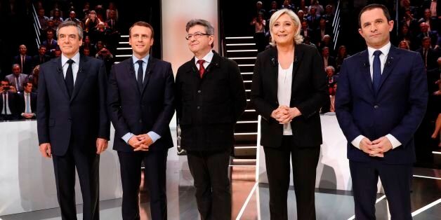 French presidential election candidates, right-wing Les Republicains (LR) party Francois Fillon, En Marche ! movement Emmanuel Macron, far-left coalition La France insoumise Jean-Luc Melenchon, far-right Front National (FN) party Marine Le Pen, and left-wing French Socialist (PS) party Benoit Hamon, pose before a debate organised by the French private TV channel TF1 on March 20, 2017 in Aubervilliers, outside Paris. / AFP PHOTO / POOL AND AFP PHOTO / Patrick KOVARIK (Photo credit should read PATRICK KOVARIK/AFP/Getty Images)