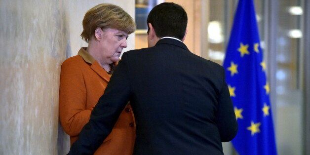 Greece's Prime Minister Alexis Tsipras (R) chats with Germany's Chancellor Angela Merkel prior to a meeting over the Balkan refugee crisis with leaders from central and eastern Europe at the EU Commission headquarters in Brussels, Belgium, October 25, 2015. REUTERS/Eric Vidal TPX IMAGES OF THE DAY
