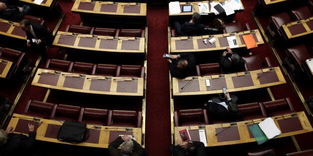 Greek lawmakers attend a parliamentary session before a vote on a one-off benefit approved to pensioners in Athens, Greece, December 15, 2016. REUTERS/Alkis Konstantinidis