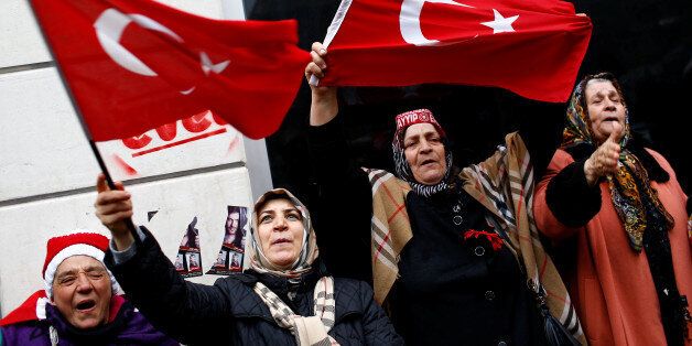 Demonstrators wave Turkish flags during a protest in front of the Dutch Consulate in Istanbul, Turkey, March 12, 2017. REUTERS/Murad Sezer