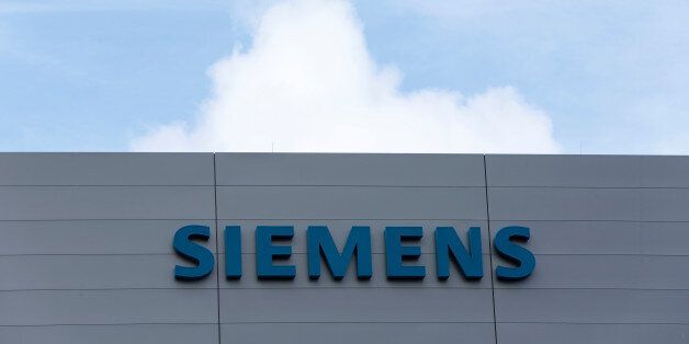 Siemens logo is pictured at a building of the manufacturing plant of Siemens Healthineers in Forchheim near Nuremberg, Germany, October 7, 2016. REUTERS/Michaela Rehle