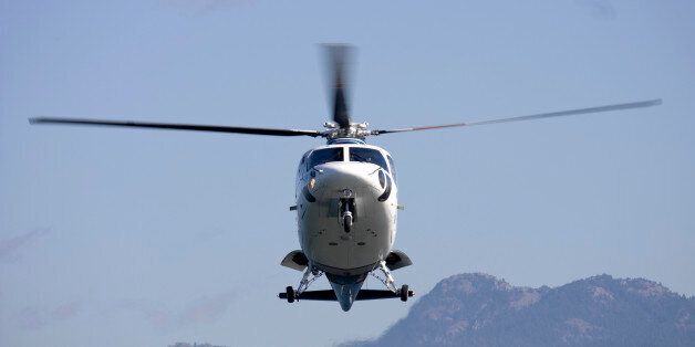 A medivac helicopter on final to land at an accident scene