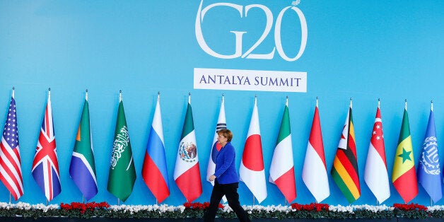 FILE PHOTO: German Chancellor Angela Merkel arrives for a welcoming ceremony during the Group of 20 (G20) leaders summit in the Mediterranean resort city of Antalya, Turkey, November 15, 2015. REUTERS/Murad Sezer/File Photo