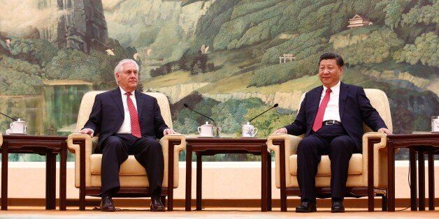 China's President Xi Jinping (R) meets with US Secretary of State Rex Tillerson (L) at the Great Hall of the People in Beijing on March 19, 2017.Tillerson met Xi on March 19 just hours after a North Korean rocket engine test added new pressure on the big powers to address the threat from Pyongyang. / AFP PHOTO / POOL / THOMAS PETER (Photo credit should read THOMAS PETER/AFP/Getty Images)