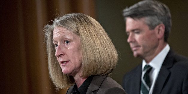 Mary McCord, acting U.S. assistant attorney general for national security, speaks as Brian Stretch, U.S. attorney for the northern district of California, right, listens during a news conference at the Department of Justice in Washington, D.C., U.S., on Wednesday, March 15, 2017. The U.S. charged four people, including two Russian intelligence officers, over the theft of hundreds of millions of accounts of Yahoo Inc. users from a computer breach that threatened to derail its acquisition by Veriz
