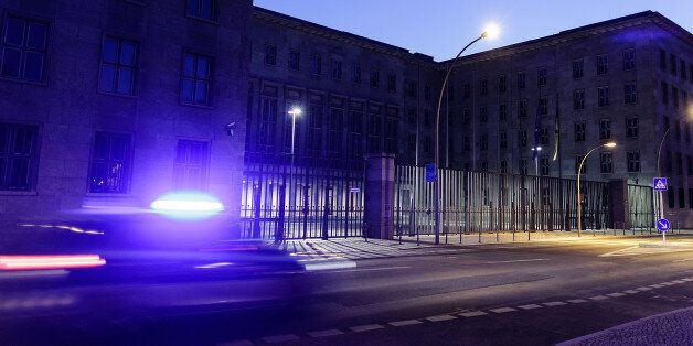 BERLIN, GERMANY - JULY 02: A police car passes the German Federal Ministry of Finance, illuminated at dusk, on July 2, 2015 in Berlin, Germany. The online whistleblower platform Wikileaks claims to have documents showing the U.S. National Security Agency (NSA) spied on German government ministries, including the ministries of finance, economy and agriculture, in the period from 2010 to 2012. The NSA has come under repeated criticism for supposedly spying on European government and political lea