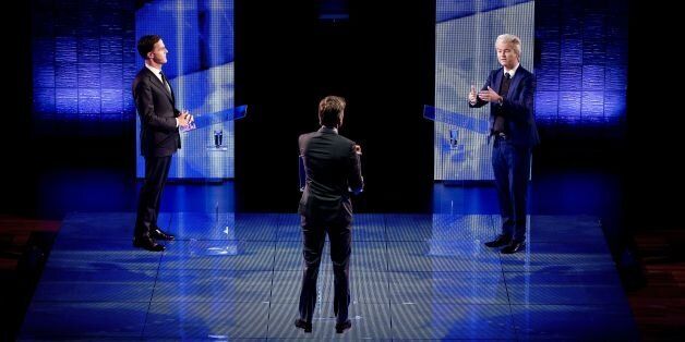 Netherlands' far-right politician Geert Wilders (R) of the PVV party gestures while during a debate with Netherlands' prime minister Mark Rutte of the VVD Liberal party on March 13, 2017 in Rotterdam, prior to March 15 Dutch national elections. / AFP PHOTO / ANP / Remko de Waal / Netherlands OUT (Photo credit should read REMKO DE WAAL/AFP/Getty Images)