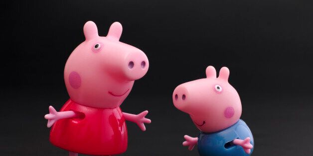 Tambov, Russian Federation - December 16, 2015: Peppa Pig and George Pig toy characters on black background. Studio shot.